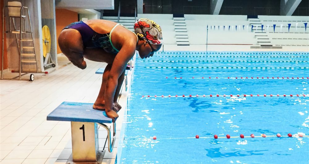 Nicaise Nicaise Mokabo in the swimming pool ready to jump in
