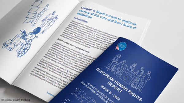 Blue cover of the human rights report next to an open edition