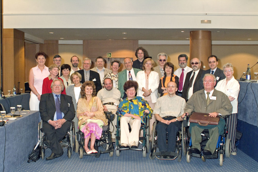 Several people, EDF board members, pose for a photo in 2005. Rodolfo is on the left next to EDF's President