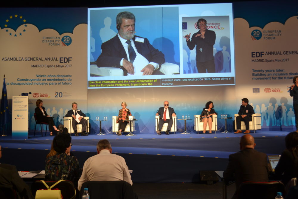A panel during our General Assembly in 2017. Rodolfo is sitted on the left and is also on the big screen
