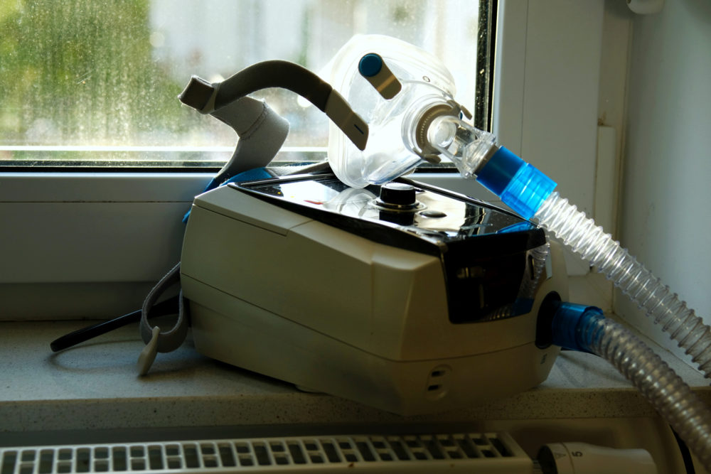 A non invasive ventilator (niv) with mask used by persons with respiratory problems at home