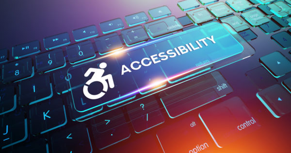 Keyboard with the word accessibility and a wheelchair sign overlayed