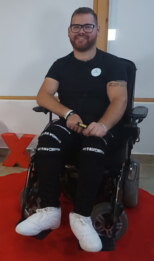 Amir smiling at the camera