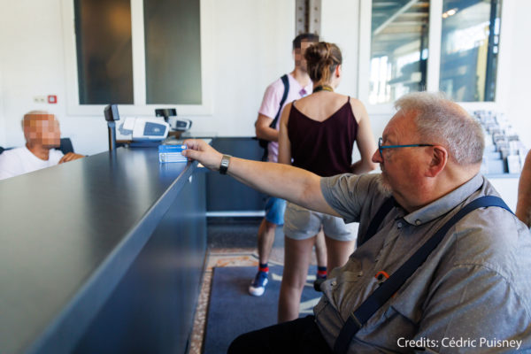 Person shows disability card in a museum