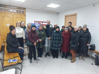 A group of people standing in a room