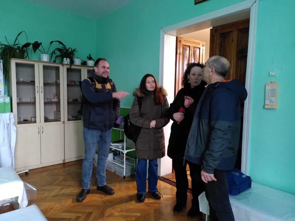 CBM, EDF and NAPD staff discussing with staroster village leader